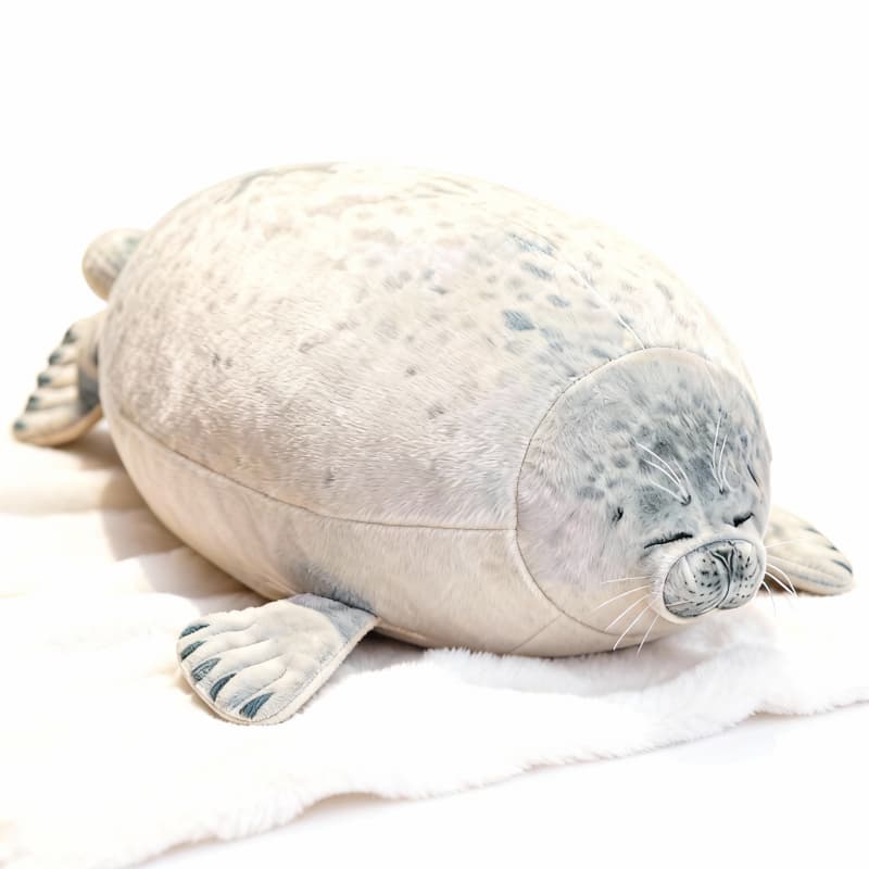 Soft gray spotted seal plushie by ToyNeighbor, featuring closed eyes and a cuddly design, perfect for snuggling.