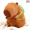 Cute 7.8" brown Capybara plushie with a turtle bag, made by ToyNeighbor, showcasing its soft texture and adorable features.