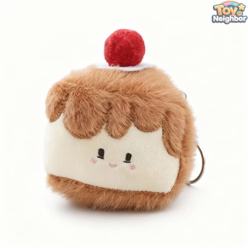 Strawberry cake plush charm by ToyNeighbor, 3.5" soft stuffed fruit cake pendant with vibrant red and green details.