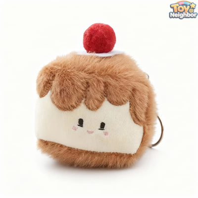 Strawberry cake plush charm by ToyNeighbor, 3.5" soft stuffed fruit cake pendant with vibrant red and green details.