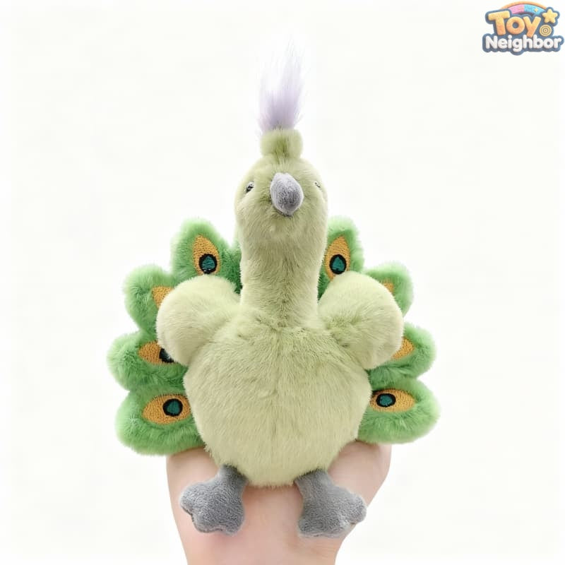 Colorful ToyNeighbor peacock plushie with soft fur and detailed features, sitting upright on a white background.