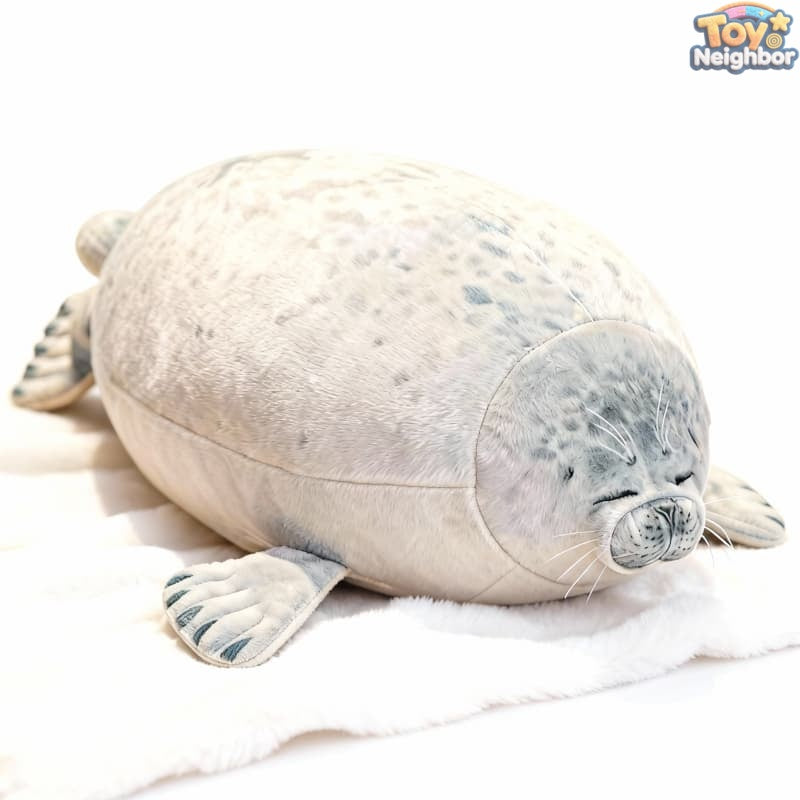 Soft gray spotted seal plushie by ToyNeighbor, featuring closed eyes and a cuddly design, perfect for hugs and play.